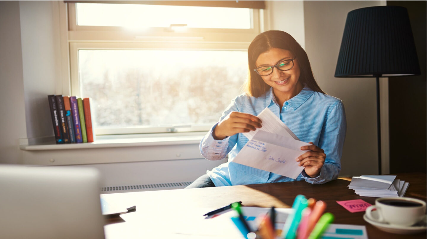 Woman Reads Direct Mail Letter With Strong Call To Action