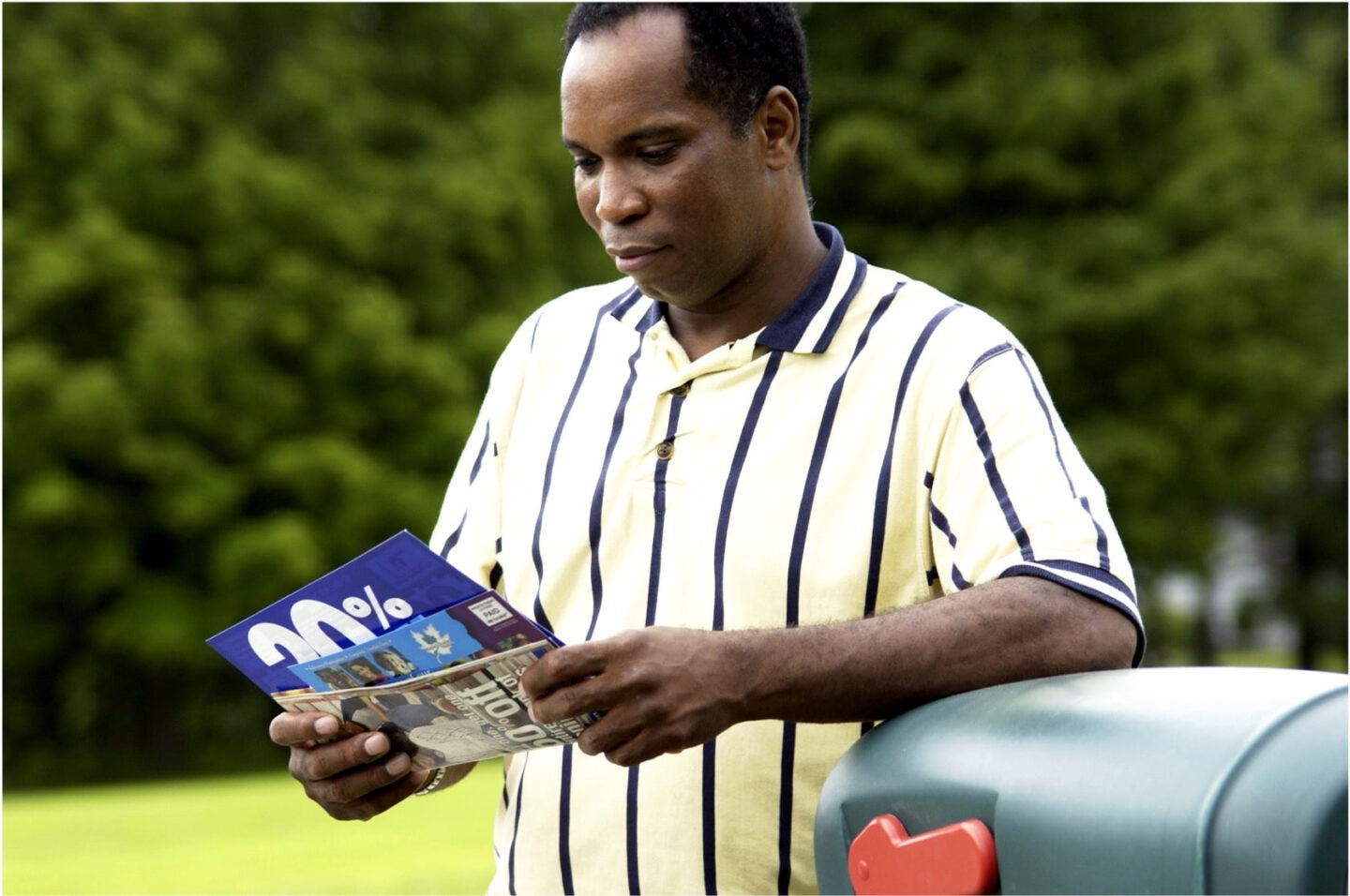 Man Reads Direct Mail Promotional Offer Sent Using Postnow