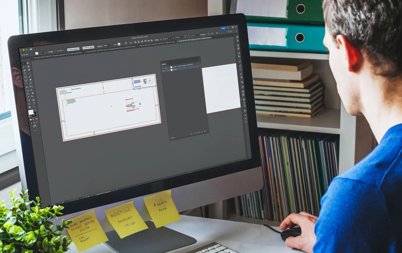 A small business owner uses a PostNow direct mail template guide on a computer.